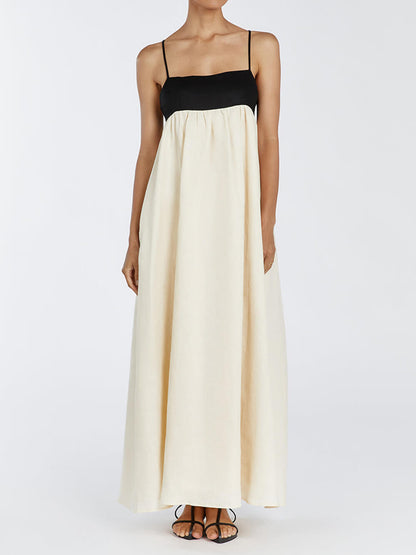 Zwart-witte maxi-jurk met losse bretels en patchwork
